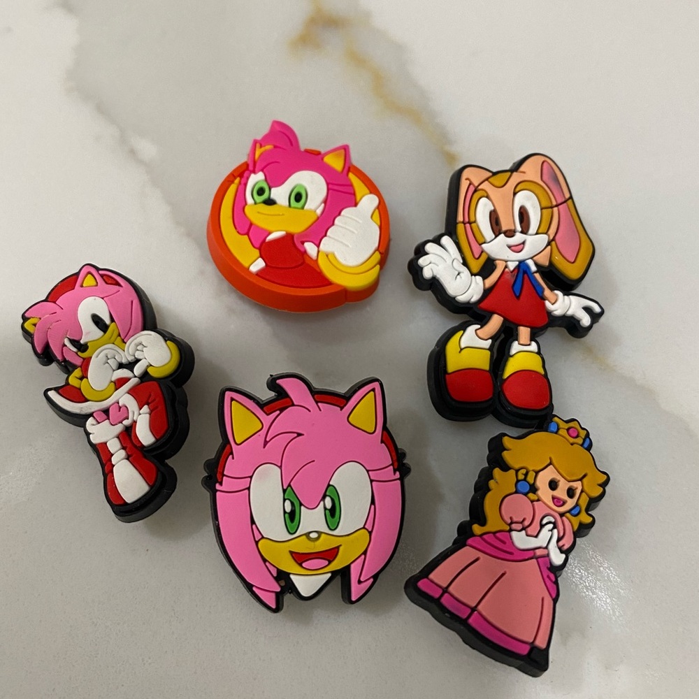 Shoe Charms- Princess Peach, Amy from Sonic & one other female character.